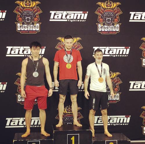 Standing on a podium after getting mostly smashed in the -75kg adult advanced bracket. I did weigh in at 58.9kg so there's that.