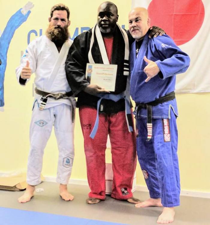 Me receiving my Blue Belt