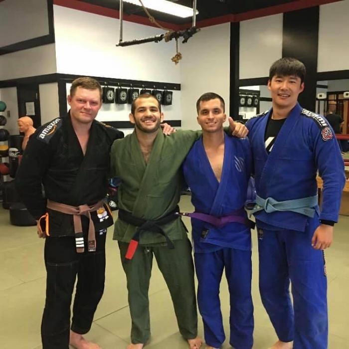 pic with my first coach Jamal Mohammed with David and Johnny getting thier purple belts.