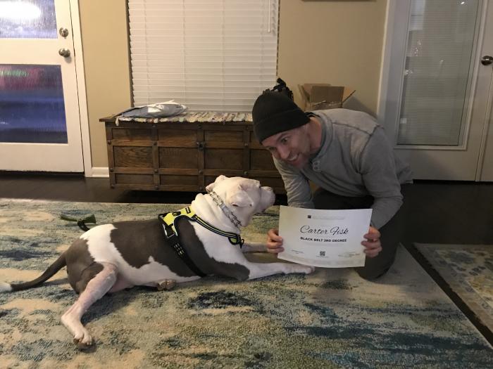 Showing off my new Belt Checker certification to my dog Hank