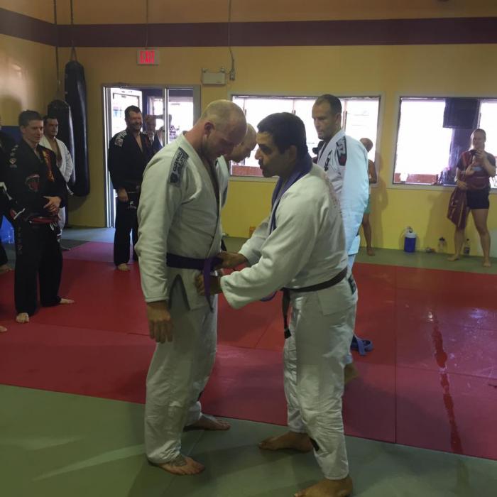 Purple belt being tied on