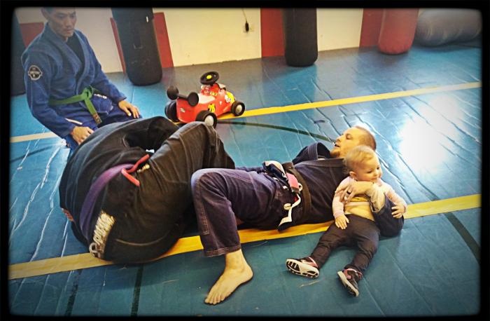I love teaching leg locks so much... I won't even put my kid down.