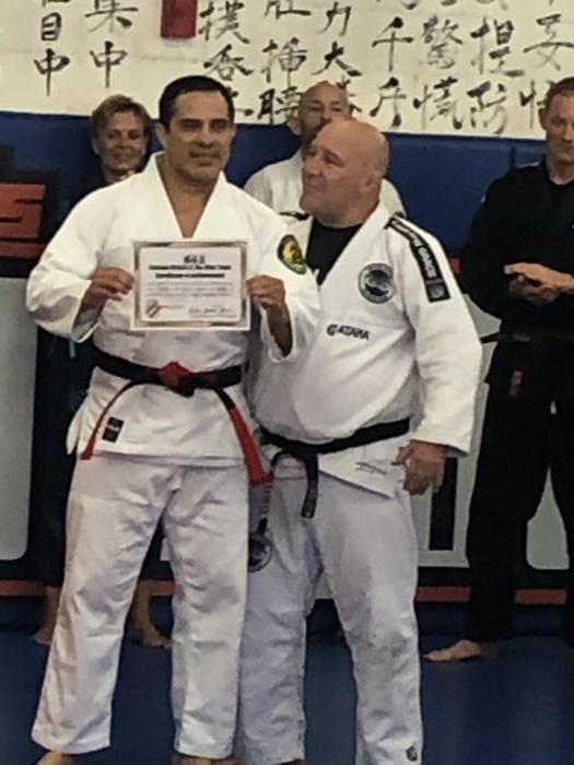Clovis Silva awarded coral belt by Carlson Jr., son of Clovis’ master, Sept 2019