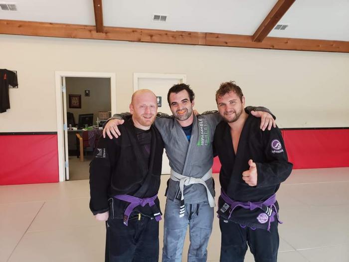 Photo of me with two of the other instructors at LBJJ, Jerad Downs and Josh Cather.