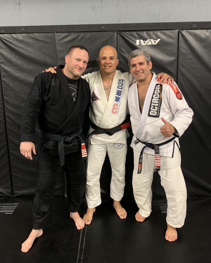 My promotion to black belt with my Professor, Mark Reding, and Professor Octavio Couto