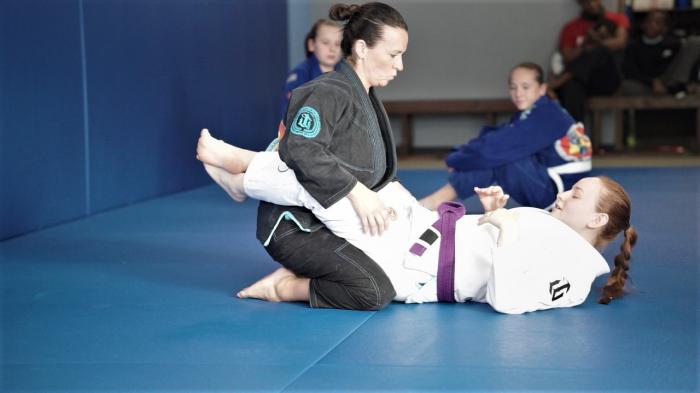 Demonstrating technique during Women's Self-Defense class