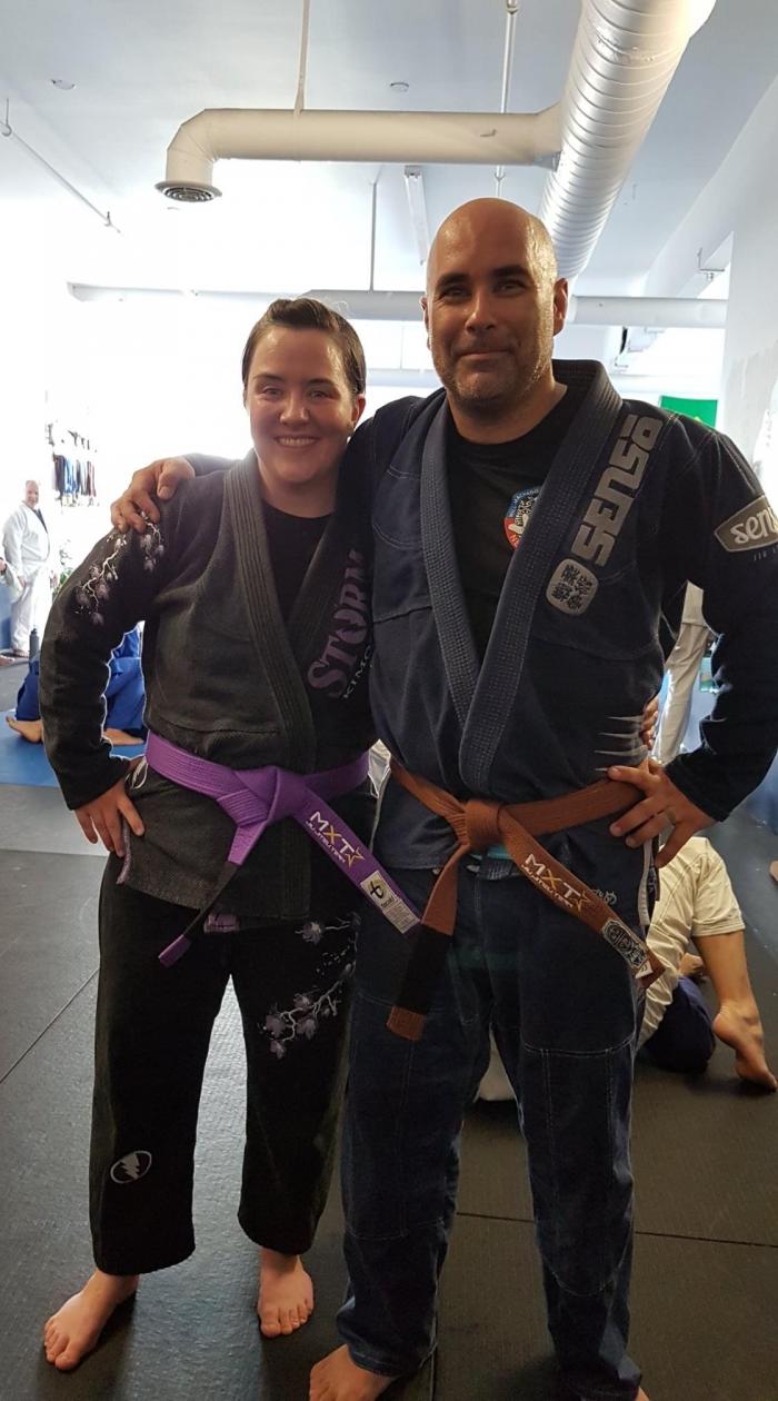 My husband and I with our new belts