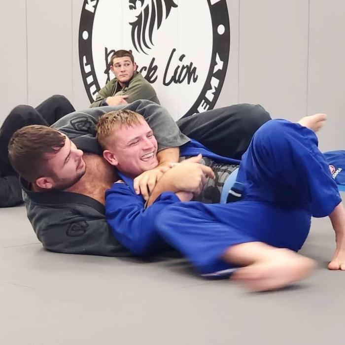 Casually laughing while being choked by Kroyler Gracie
