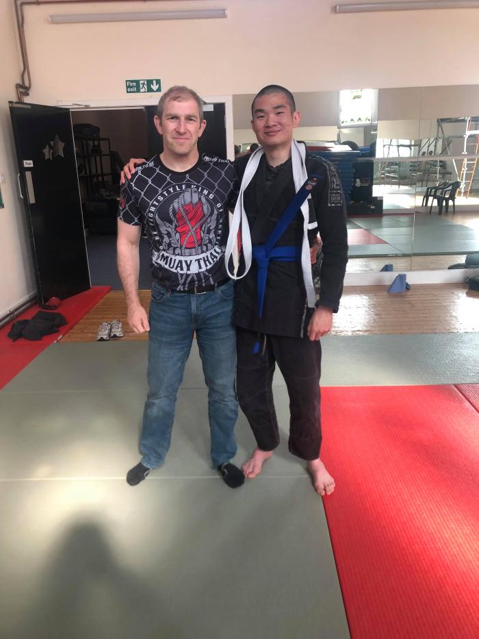 Promotion to blue belt by coach Billy