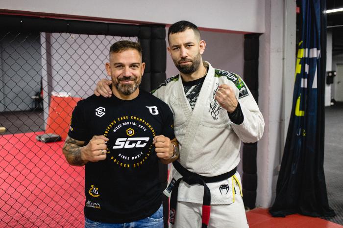 With my kickboxing instructor. Ironically, I wouldn't be a BJJ black belt or still training if it wasn't for him.