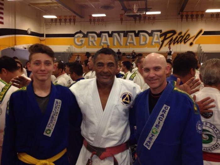 My son Cade, Master Rickson Gracie and myself at Master Charles’ promotion to 7th degree Coral Belt.