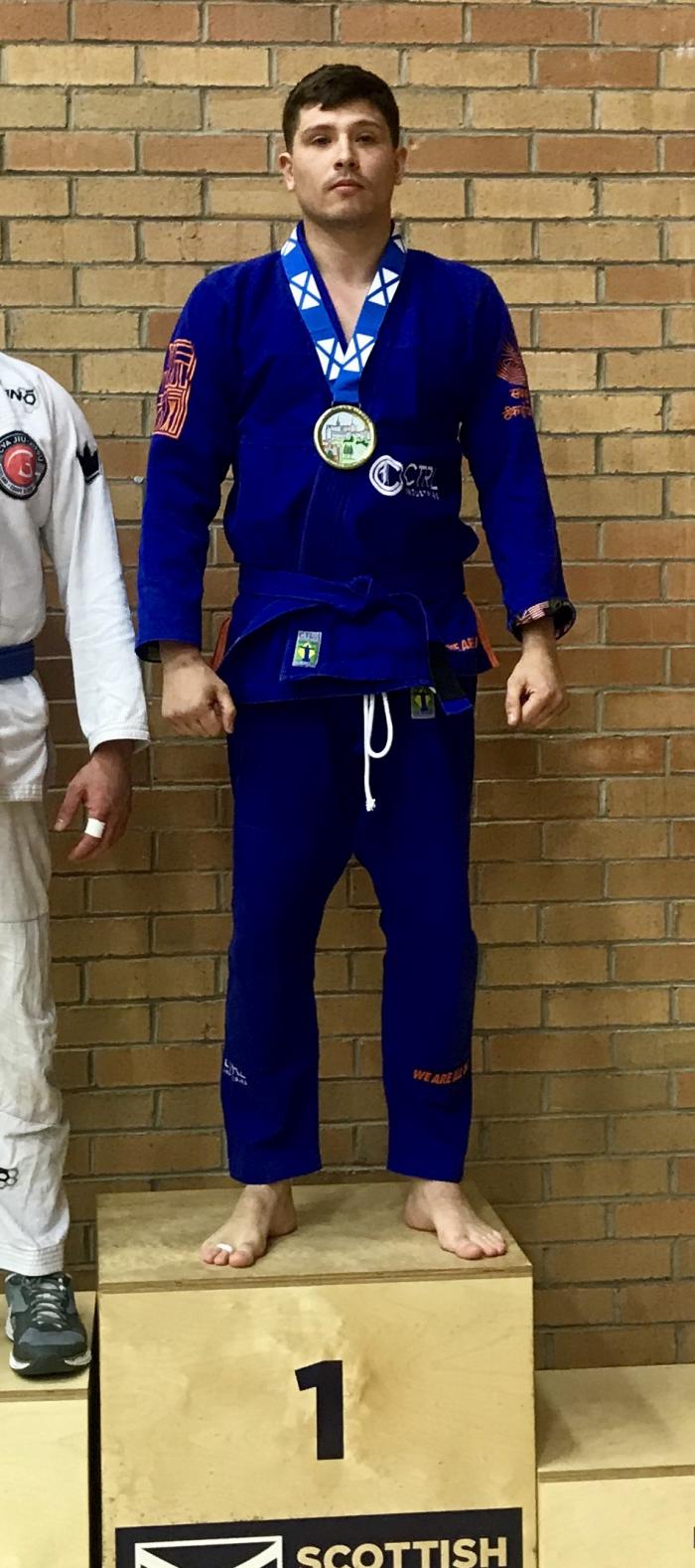 Gold at blue belt