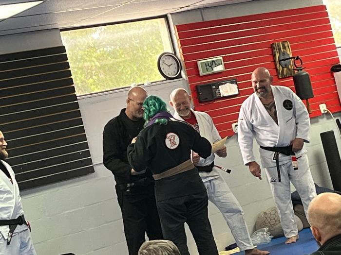 Getting my purple belt from my professors. My jiu jitsu brother Brad May's belt. <3