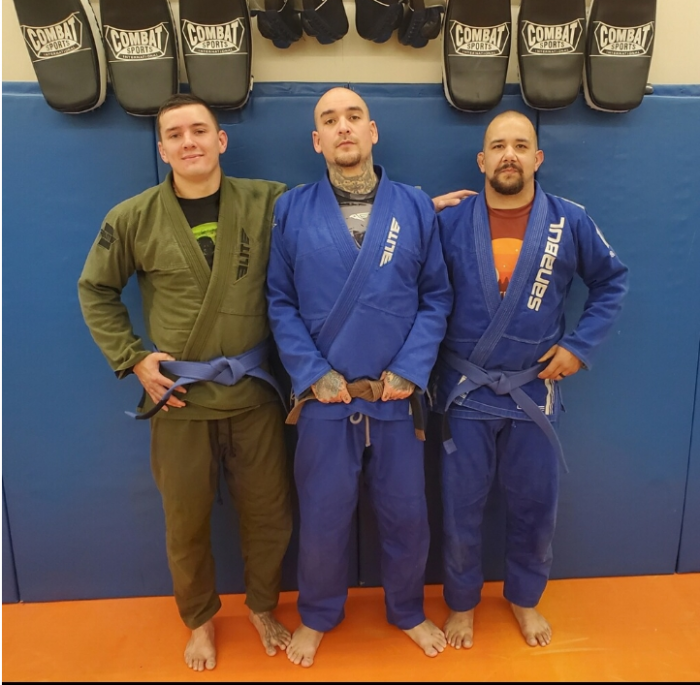 Caleb & coach Alex. Caleb, one of my main teammates that helped me level up. This is us with our fresh blue belts.