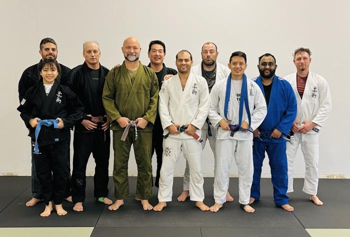 Newly minted purple belt with the morning crew at Diamondback Jiu-Jitsu in Frisco, Texas.