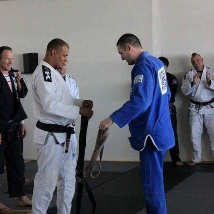 Getting my Black belt tied on by Charuto Verissimo
