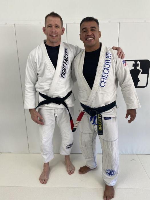 Standing next to my professor, in a complete state of shock, for a post promotion picture. Had the honor of being one of seven that was promoted to black belt.