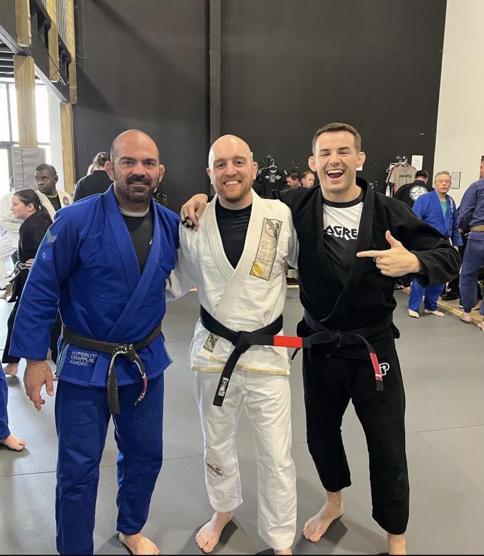 Black belt promotion for Josh Kennon of Precision Martial Arts Flowood. Picture featuring professor Anthony Mitchell, Josh Kennon, Jeff Mount JR.