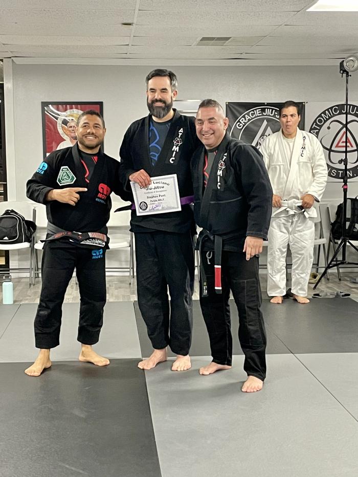 Purple belt awarded by Master Cleber Luciano and Professor Adrian Trevino at Atomic Jiu Jitsu