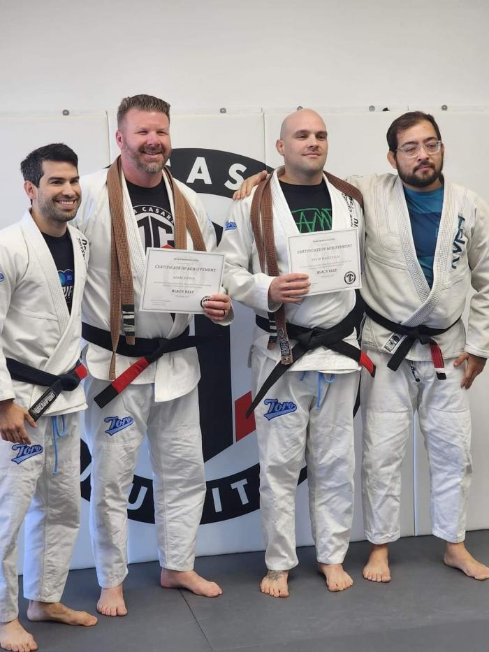 Adam and I getting our belts