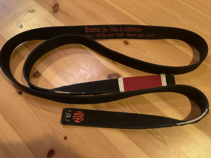 My BJJ belt, with inscription and family ”logo”, a gift from my son.