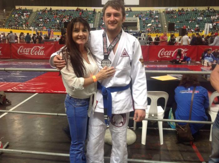 Mom supporting me at tournament. Not sure where or when. Long time ago.