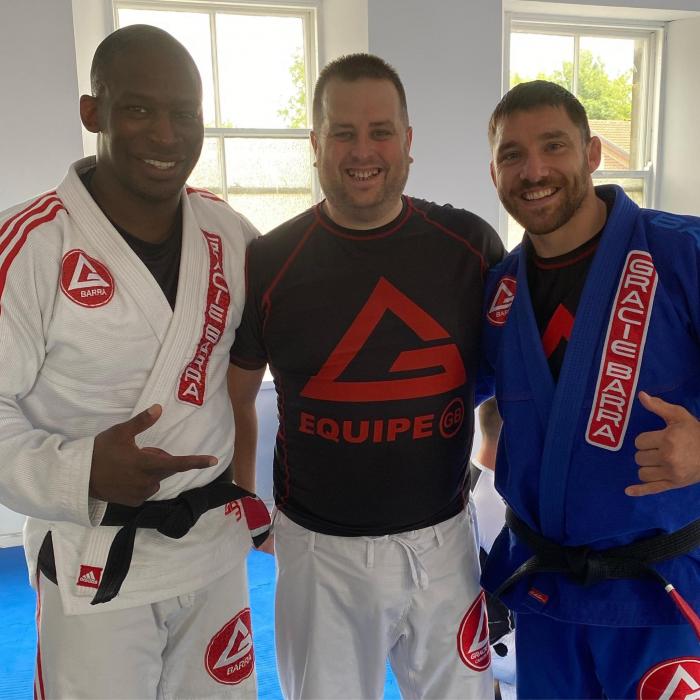 Professors Adrian Tweed and Darren Clark on getting my second white belt strip