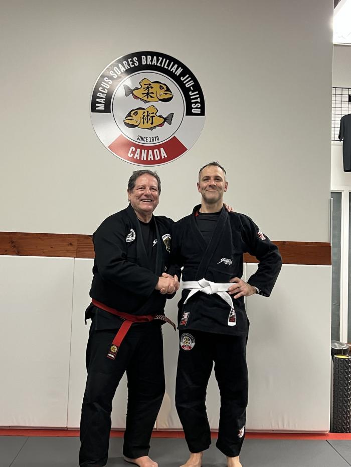 Master Marcus presenting me with my first stripe! December 2022