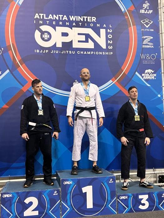 Tim black belt on podium ibjjf