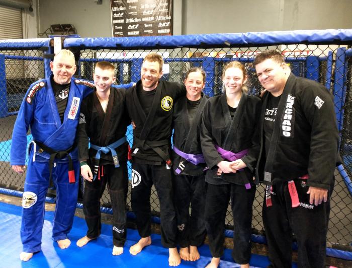 My family at CSW with Coach Erik Paulson and Master Rigan Machado, World Conference 2023