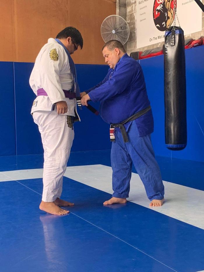 My coach awarding me a purple belt 04 Feb 2023