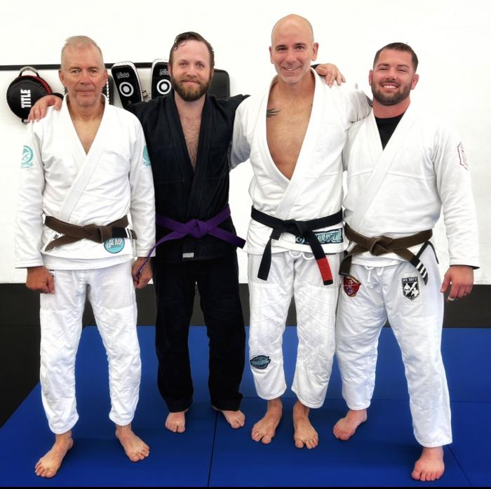 My purple belt promotion with my three coaches