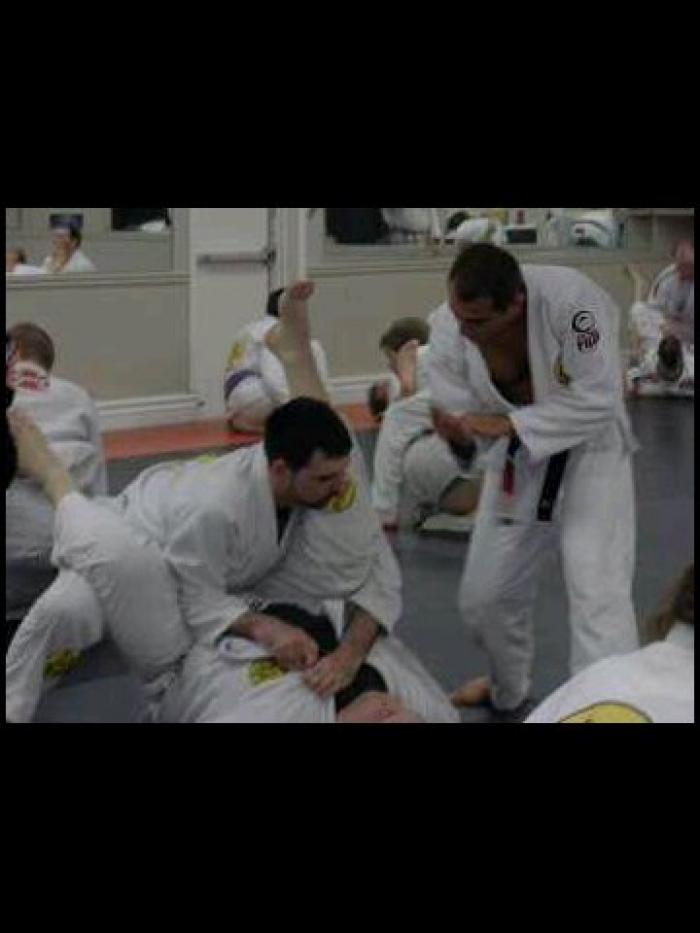 Royler Gracie helping me with a guard pass at a seminar in 2011