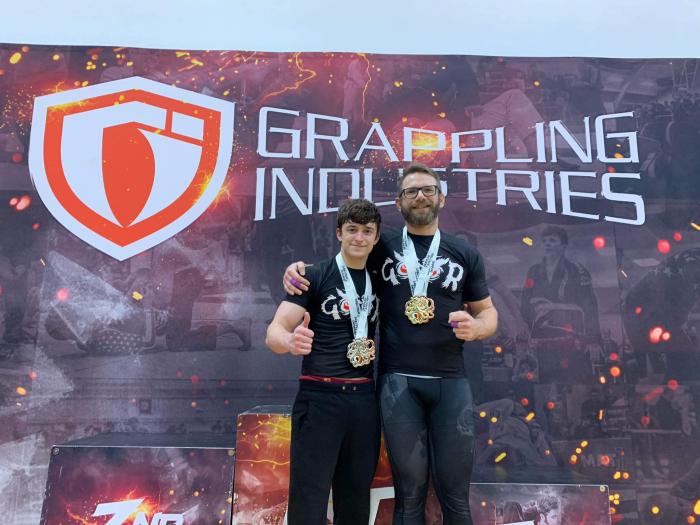 My teammate Kameron Lilly and I with some hardware at Grappling Industries January 7, 2023