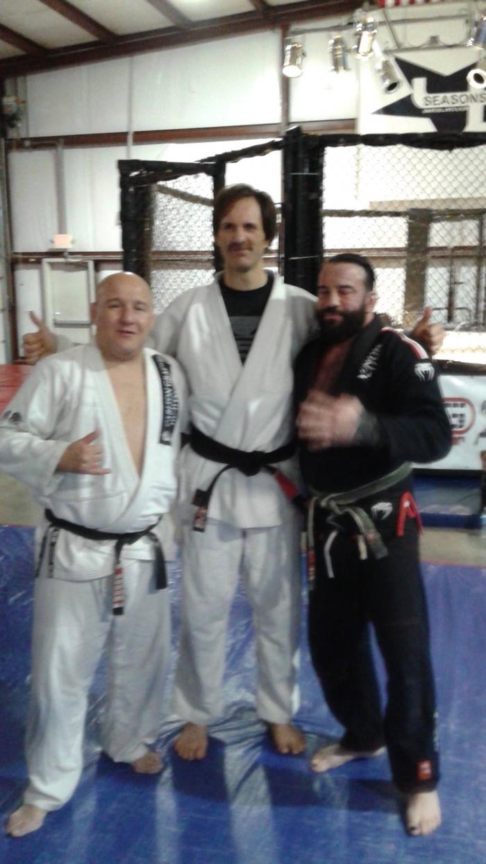 Posing with Mike O'Donnell and Carlson Jr after black belt promotion