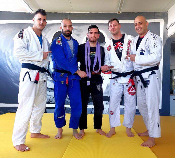 Promoting my student to brown belt with coach C.Marquez  at Gracie Barra Greece headquarters