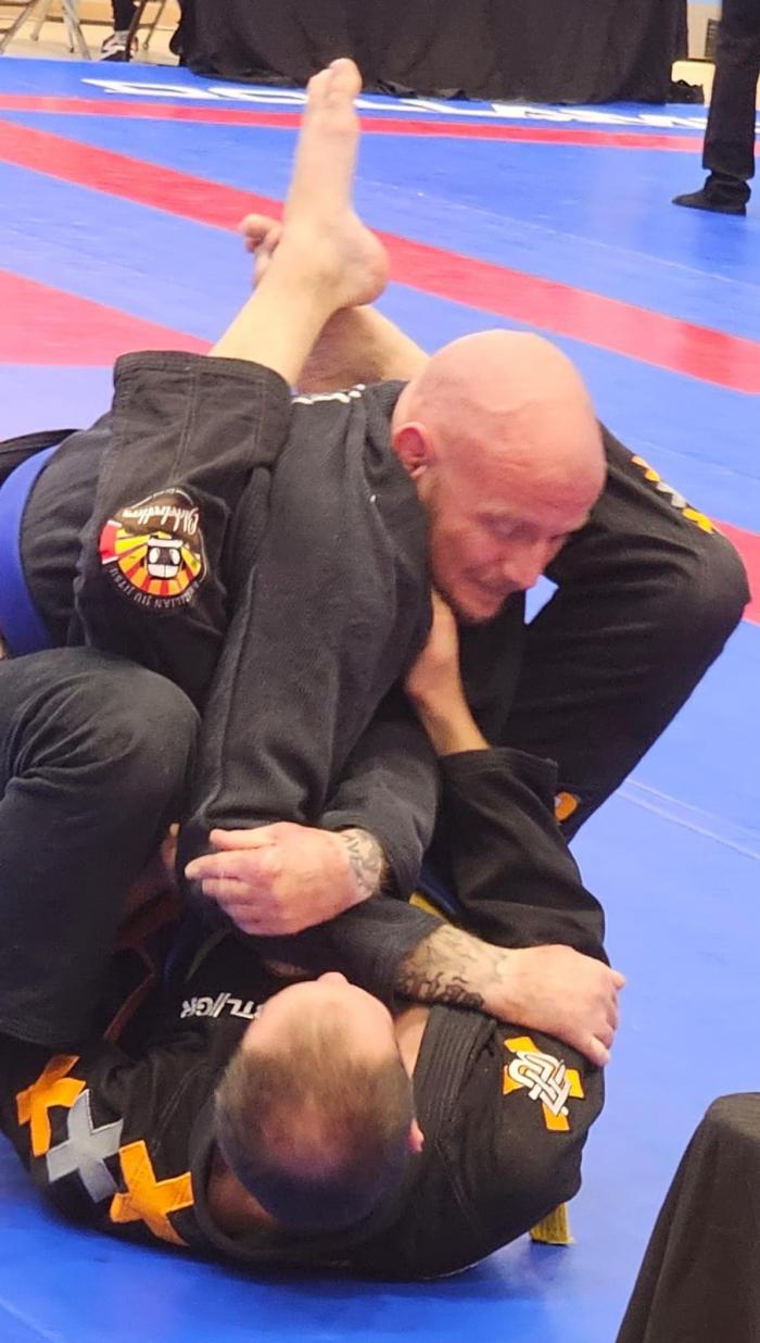 Armbar set up for Gold in Surrey Open 2023 Absolute