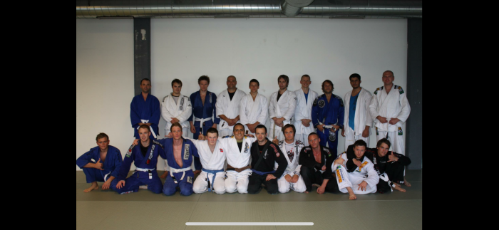 Me (5 back from right) as white belt at Tommy Langaker’s blue belt promotion (2012)