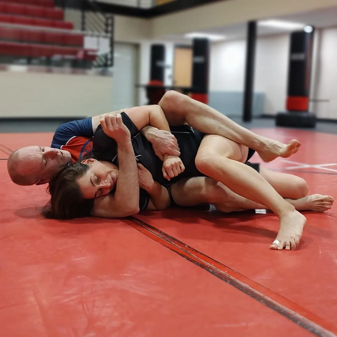 Rolling with fellow coach Deanne Moosman at VMI BJJ Club practice