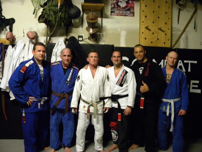 2011 Black Belt Promotion with some old friends. The red tape on my knee was me begging Haueter to leave that knee alone, since my LCL was torn.