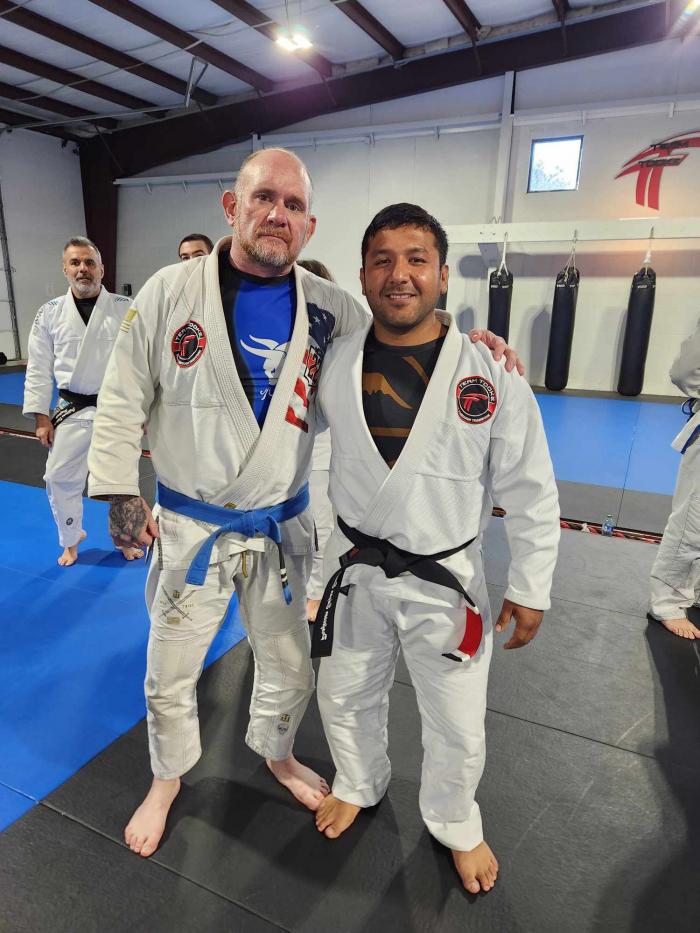 Good friend and student, Jesse, at my Black Belt graduation