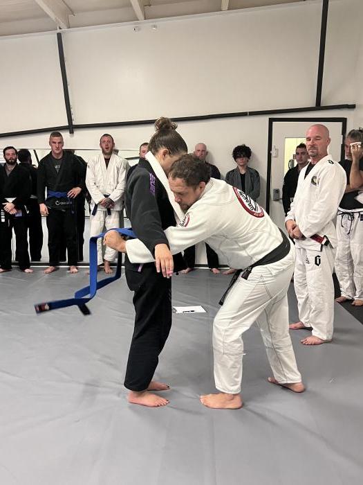 Receiving my blue belt from Jeff Curran in October 2023