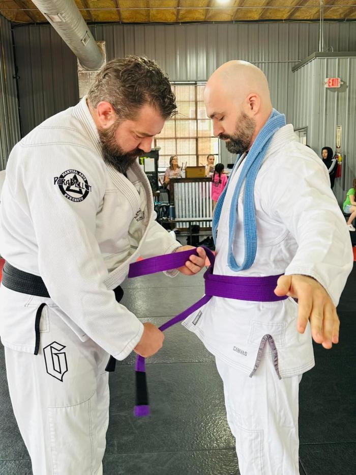 Professor Jesse Briggs giving me my purple belt