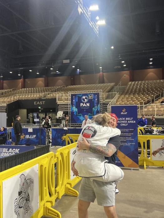 Seeing my husband & Professor for the 1st time after winning 🥇 at Pans 2024. I love this pic! 🥰