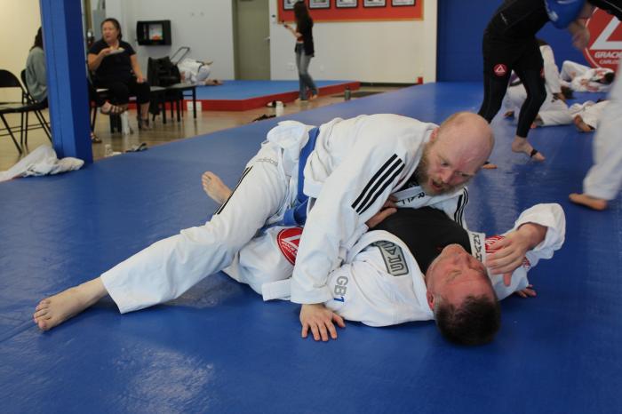 Rolling with a white belt. Dont know why I look so intense.