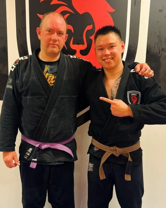 Purple belt 1st stripe promotion with coach Adrian Olsen.