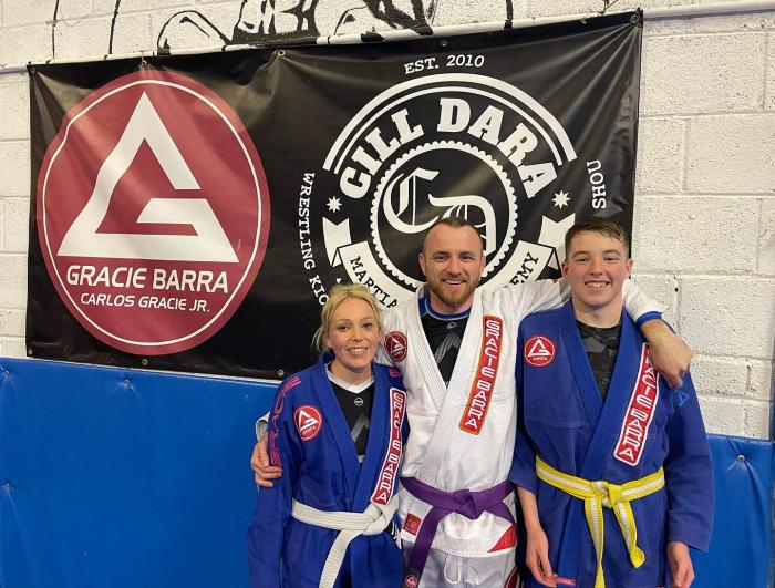 Jiu Jitsu Family. My wife Dawn (Blue Belt) and Son Caine (Blue belt now ,Yellow belt in the pic. )