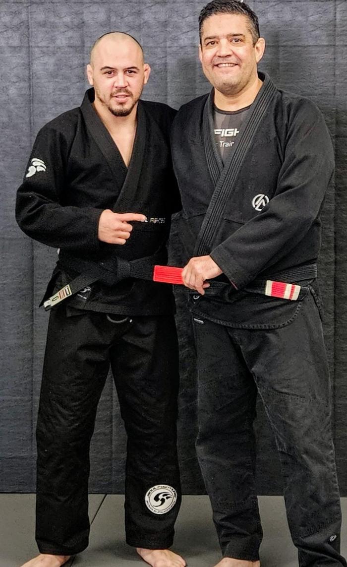 Jarrod Trotter receiving his Black Belt from Bruno Mendes