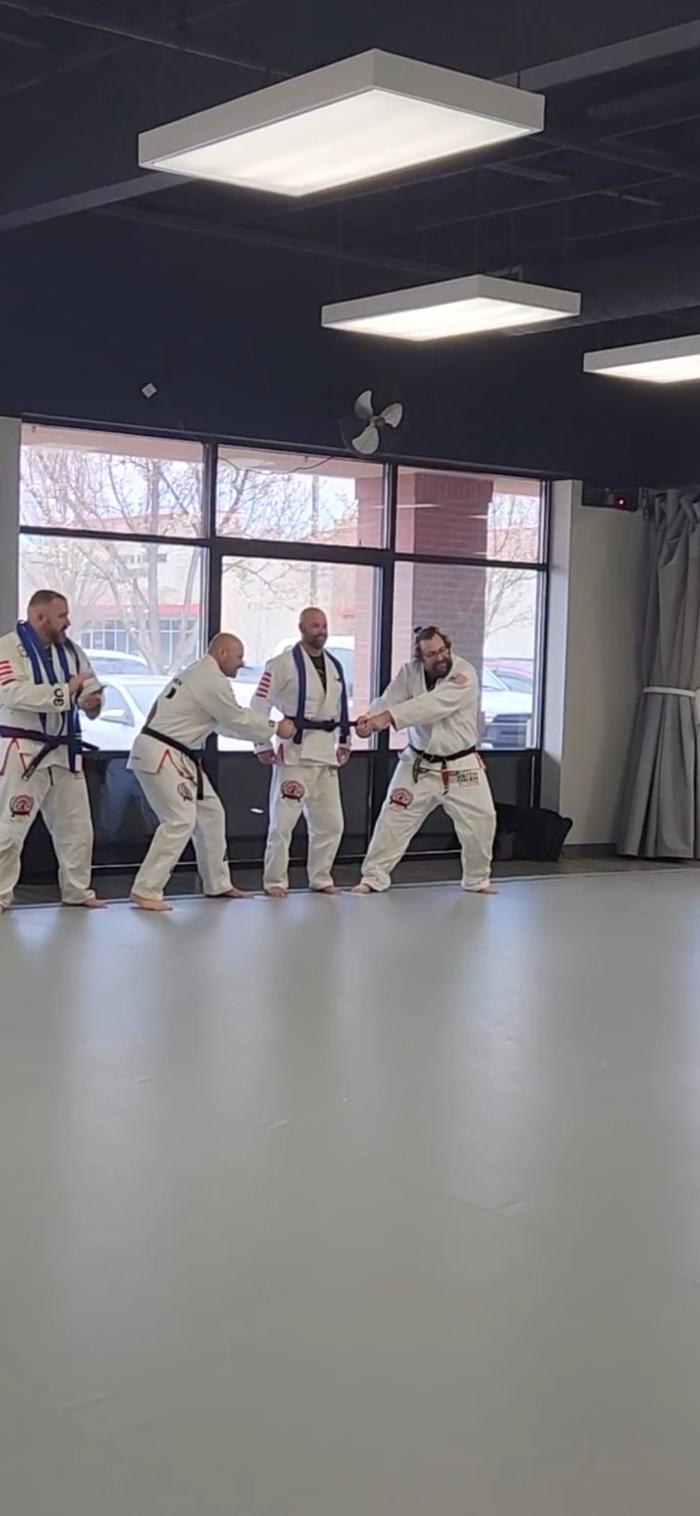 Purple belt - belting by 2nd degree black belt Todd Richards and 2nd degree black belt Josh Arentz
