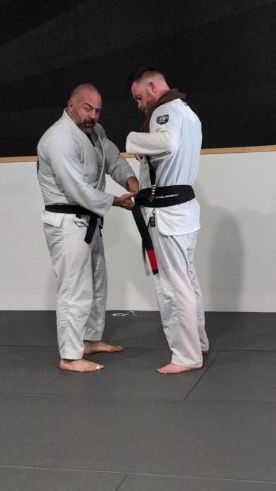 Black belt being tied on